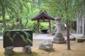 A Japanese garden lantern and chozuya Royalty Free Stock Photo