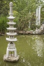 Japanese garden lantern on water background. Royalty Free Stock Photo