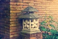 Japanese garden stone lantern lamp it around the flowers grow Royalty Free Stock Photo