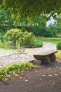 Japanese garden with stone path, bench and pond Royalty Free Stock Photo