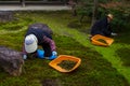 Japanese gardeners work in a garden of Kenninji temple