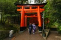 Japanese Geisha and partner at Fushimi Inari Shrine gardens in Kyoto