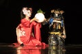 Japanese geisha in traditional kimono and fox mask holding sphere lamp and samurai warrior in armor