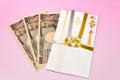 Japanese gift envelope and Ten thousand yen bill. Royalty Free Stock Photo