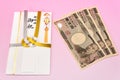 Japanese gift envelope and Ten thousand yen bill. Royalty Free Stock Photo