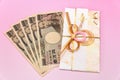 Japanese gift envelope and Ten thousand yen bill. Royalty Free Stock Photo