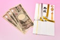 Japanese gift envelope and Ten thousand yen bill. Royalty Free Stock Photo