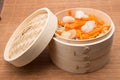 Japanese giozas with vegetables in a bamboo steamer