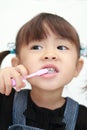 Japanese girl brushing her teeth Royalty Free Stock Photo