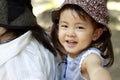 Japanese girl carried in her mother`s back