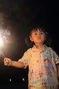 Japanese girl doing handheld fireworks Royalty Free Stock Photo