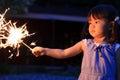 Japanese girl doing handheld fireworks Royalty Free Stock Photo