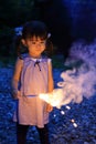 Japanese girl doing handheld fireworks Royalty Free Stock Photo