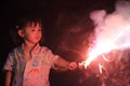 Japanese girl doing handheld fireworks Royalty Free Stock Photo