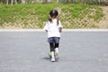 Japanese girl dribbling soccer ball Royalty Free Stock Photo