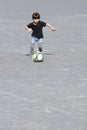 Japanese girl dribbling soccer ball Royalty Free Stock Photo