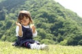 Japanese girl eating rice cracker Royalty Free Stock Photo