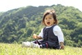 Japanese girl eating rice cracker Royalty Free Stock Photo