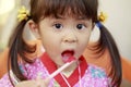 Japanese girl eating shaved ice in Yukata