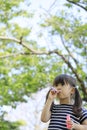 Japanese girl playing with bubble in the green Royalty Free Stock Photo