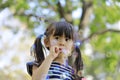 Japanese girl playing with bubble in the green Royalty Free Stock Photo