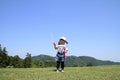 Japanese girl playing with bubble under the blue sky Royalty Free Stock Photo