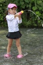 Japanese girl playing in the river Royalty Free Stock Photo