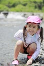 Japanese girl playing in the river Royalty Free Stock Photo