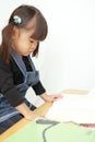 Japanese girl reading a picture book Royalty Free Stock Photo