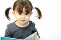 Japanese girl reading a picture book Royalty Free Stock Photo