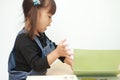 Japanese girl reading a picture book Royalty Free Stock Photo