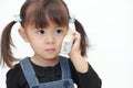 Japanese girl talking on the phone Royalty Free Stock Photo