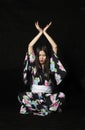 Japanese girl in traditional Japanese kimono on black background