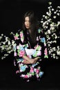 Japanese girl in traditional Japanese kimono, holds sprigs of ch