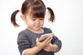 Japanese girl using a smart phone Royalty Free Stock Photo