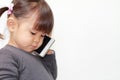 Japanese girl using a smart phone Royalty Free Stock Photo