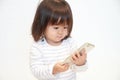 Japanese girl using a smart phone Royalty Free Stock Photo