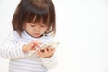 Japanese girl using a smart phone Royalty Free Stock Photo