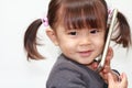 Japanese girl using a smart phone Royalty Free Stock Photo