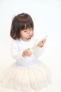 Japanese girl using a smart phone Royalty Free Stock Photo