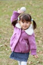 Japanese girl playing catch Royalty Free Stock Photo