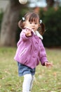 Japanese girl playing catch Royalty Free Stock Photo