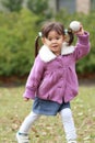 Japanese girl playing catch Royalty Free Stock Photo