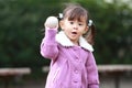 Japanese girl playing catch Royalty Free Stock Photo