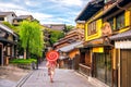 Japanese girl in Yukata with red umbrella in old town Kyoto Royalty Free Stock Photo