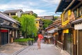 Japanese girl in Yukata with red umbrella in old town Kyoto Royalty Free Stock Photo