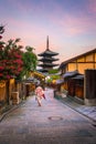 Japanese girl in Yukata with red umbrella in old town Kyoto Royalty Free Stock Photo