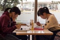 Japanese girls at a coffee shop.