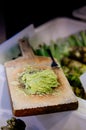 Japanese grated fresh Wasabi on traditional shark skin wooden gr Royalty Free Stock Photo