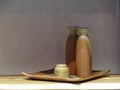 Japanese green and brown sake ceramic sets on square tray with shadow